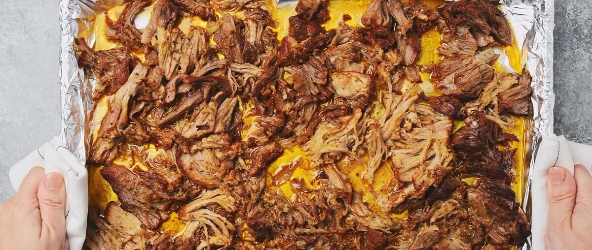 Broiled pork on an aluminum foil lined cookie sheet.  - 9