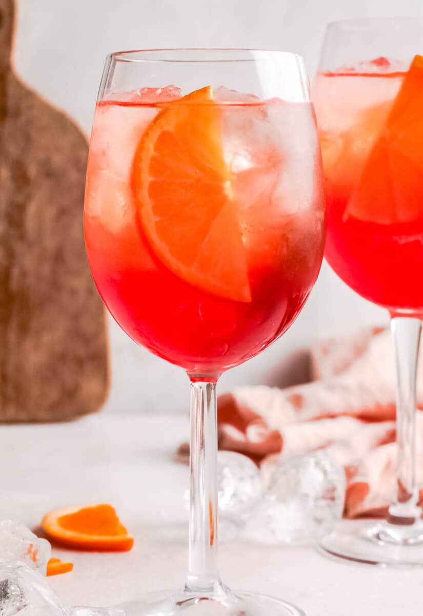 up tropical two glasses of aperol spritz