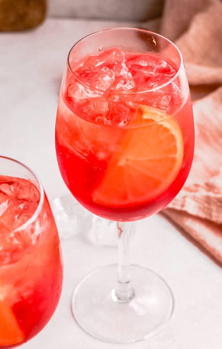 up tropical aperol spritz with orange slice