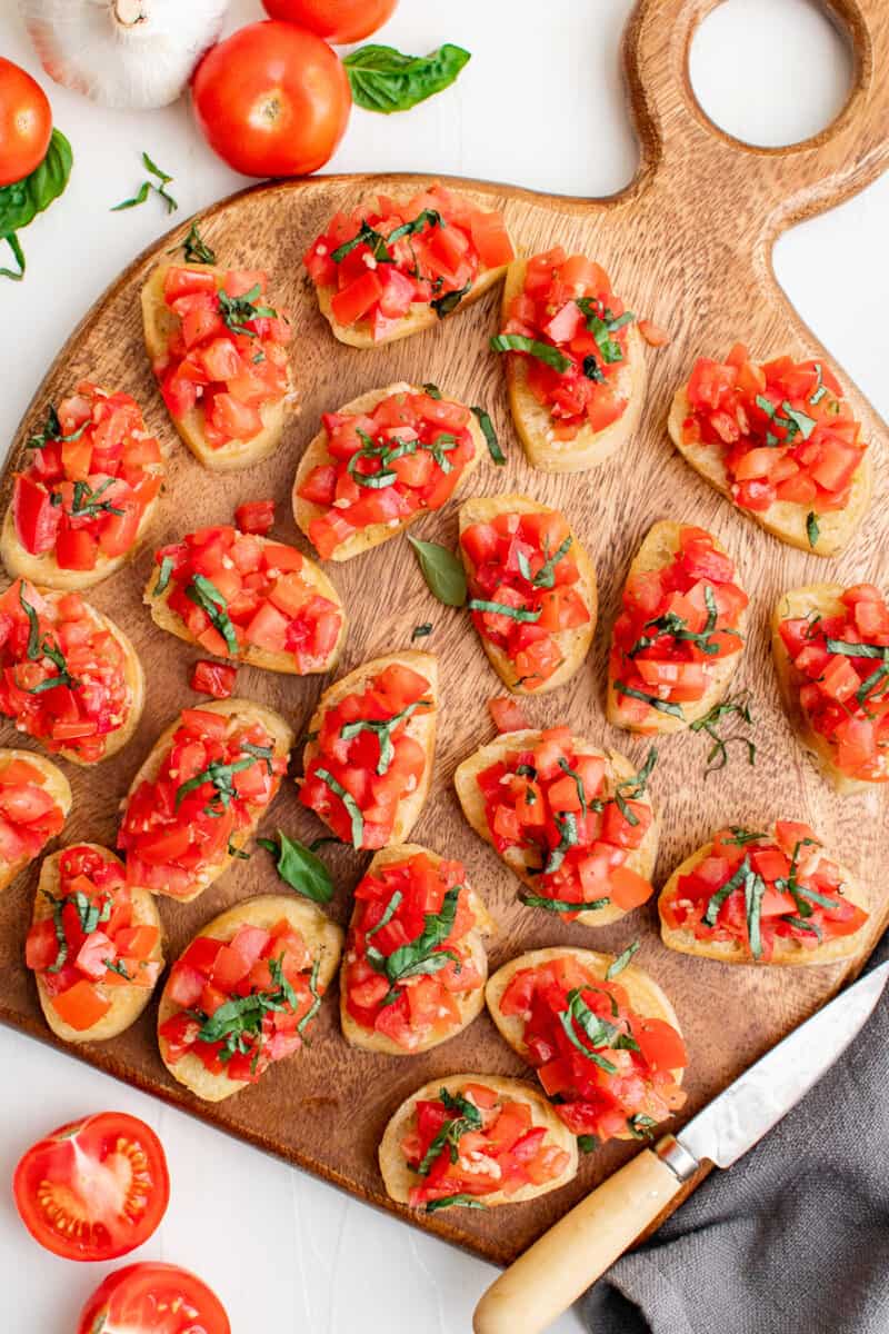 tomato bruschetta on wooden platter