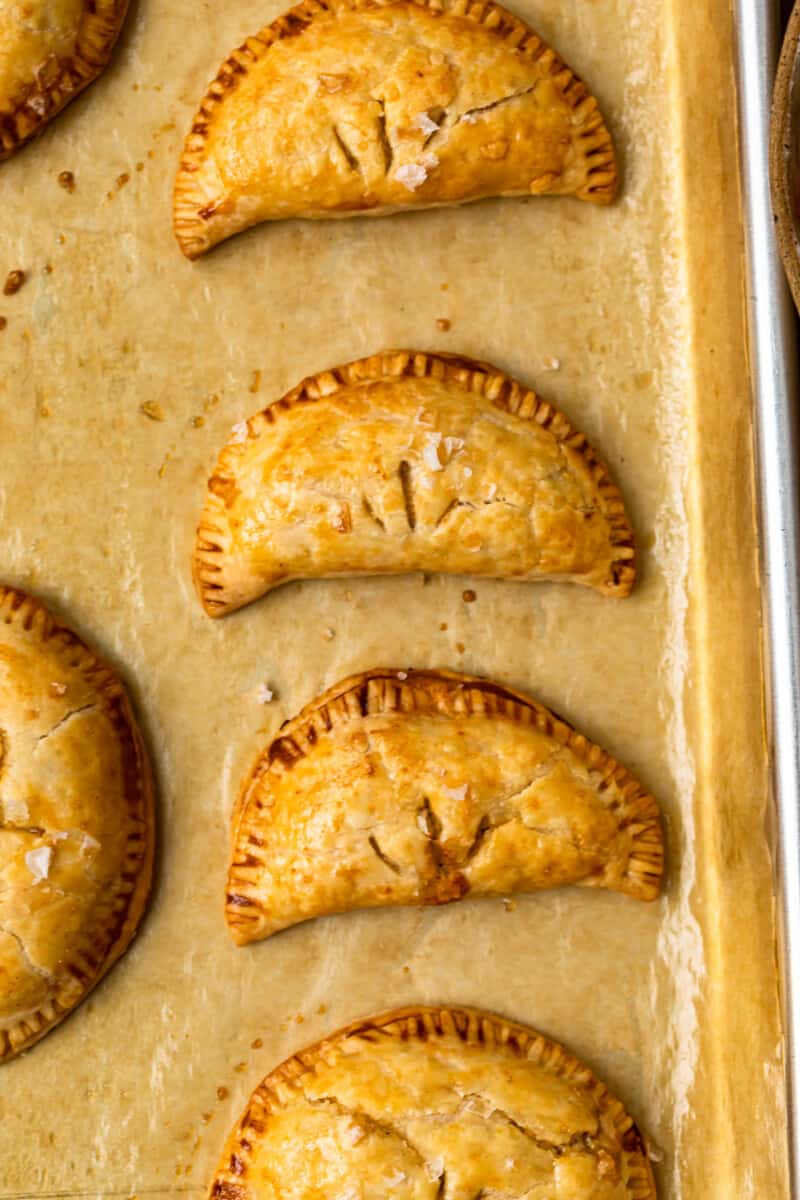 chicken empanadas on baking sheet