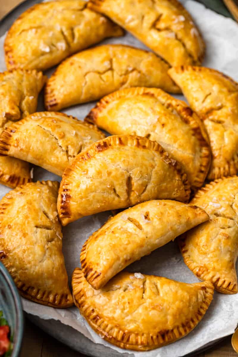 baked chicken empanadas on platter