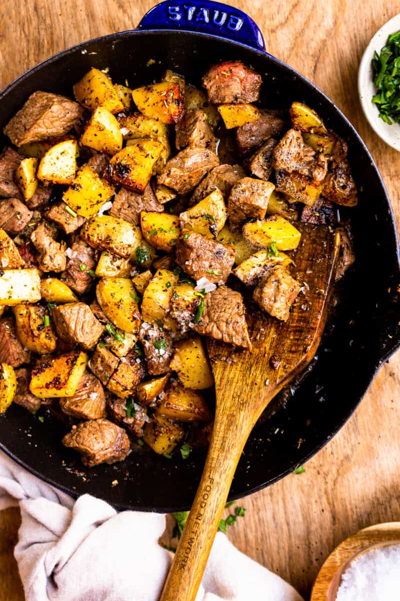 skillet with steak and potatoes