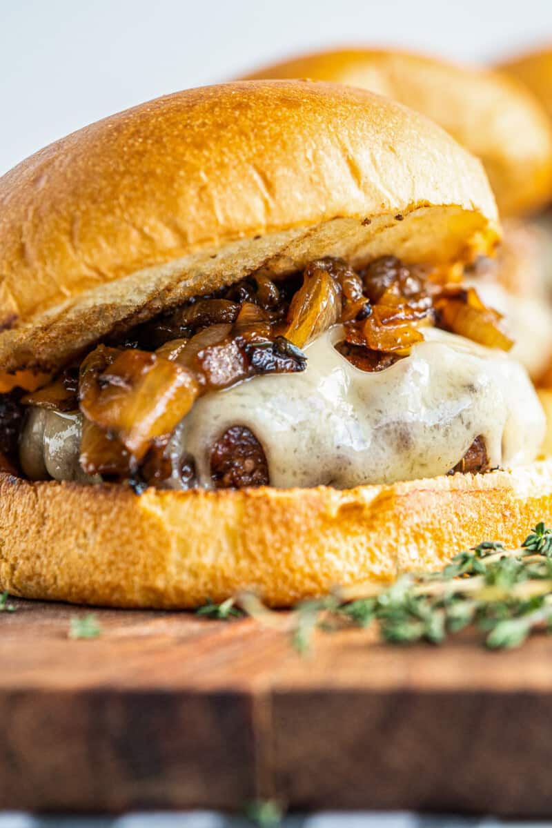 up close image of caramelized onion swiss burger