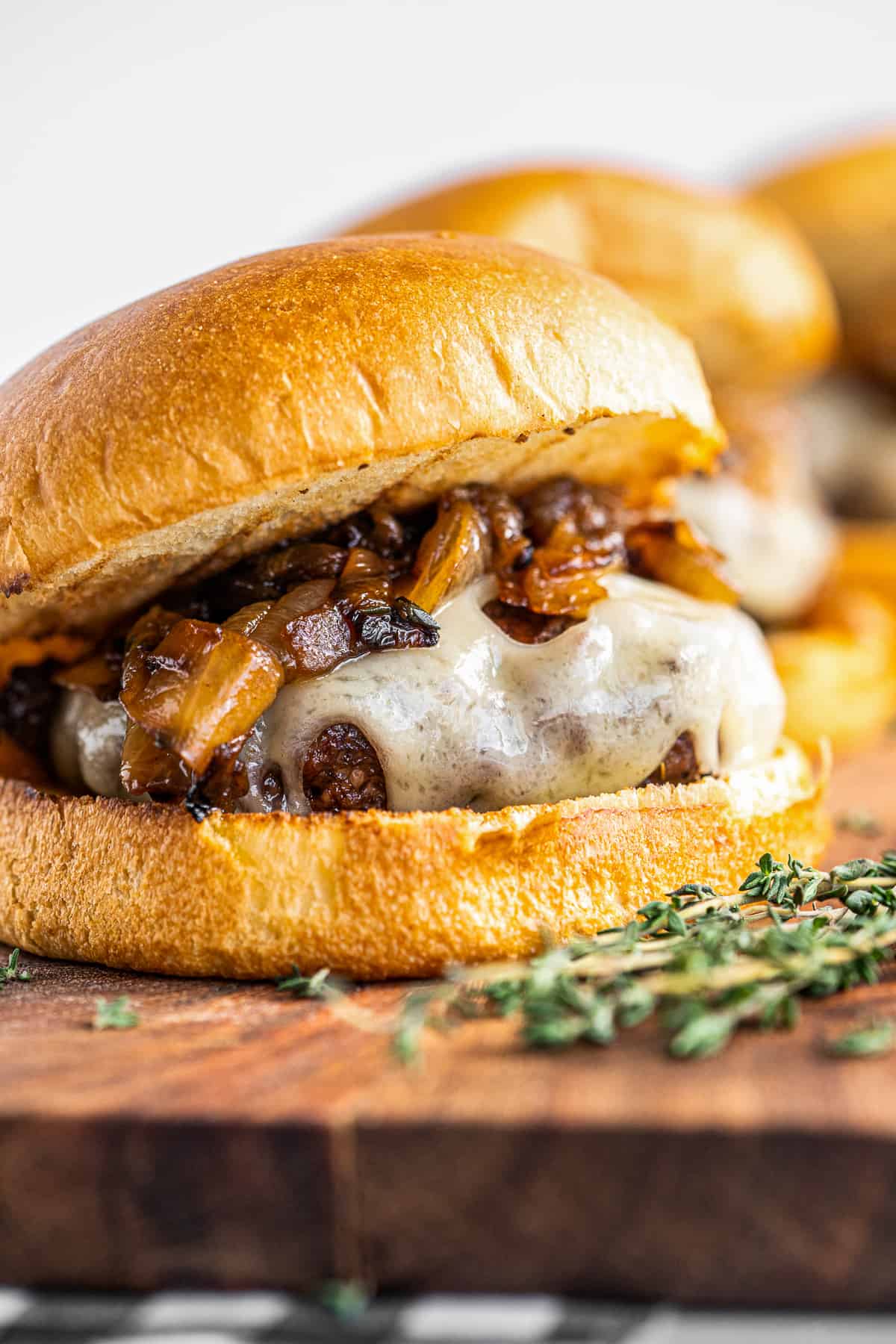 up close image of caramelized onion swiss burger