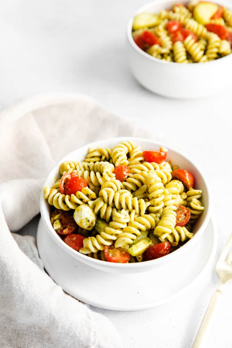 pesto pasta salad in white bowls