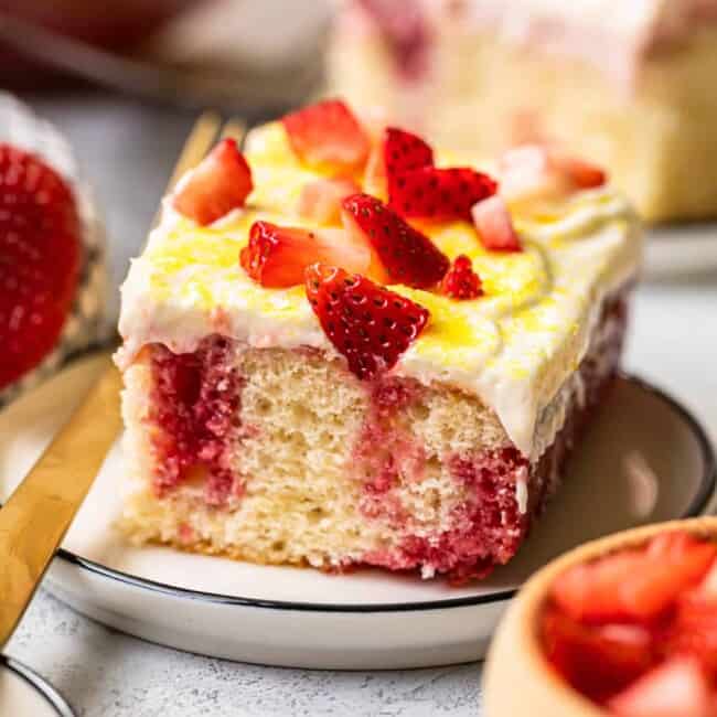 slice of strawberry lemonade poke cake