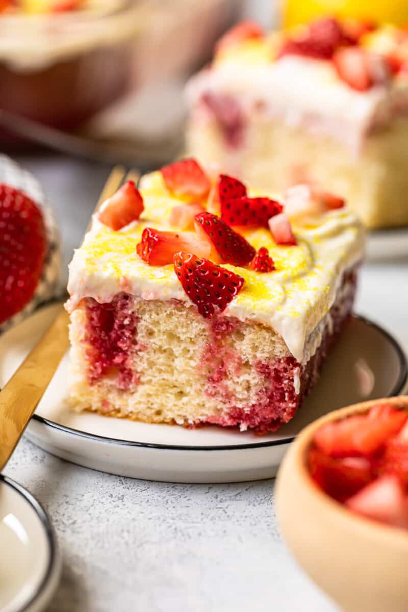 slice of strawberry lemonade poke cake