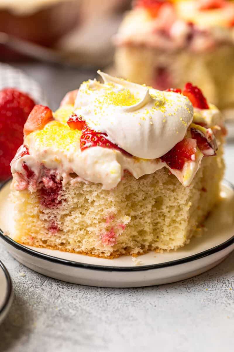 bite out of strawberry lemonade poke cake