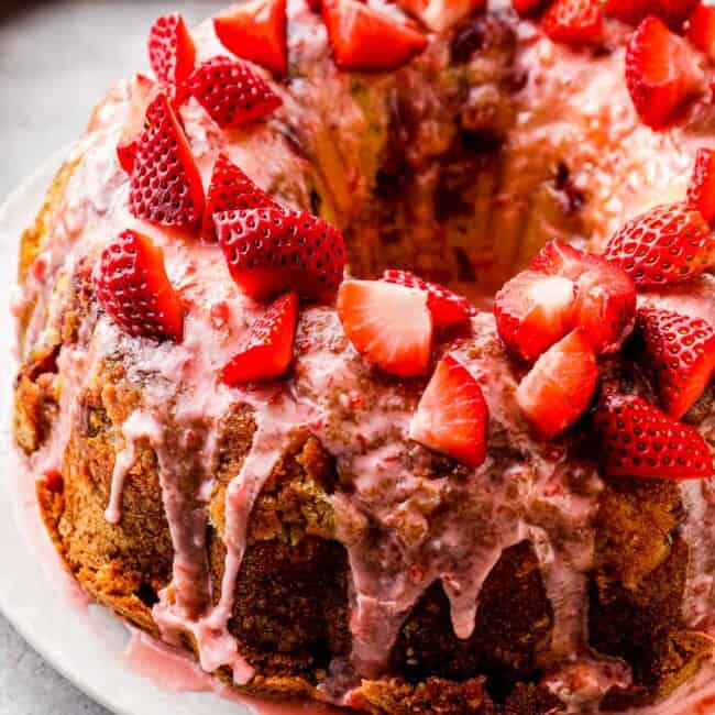 side shot of strawberry pound cake with strawberry glaze