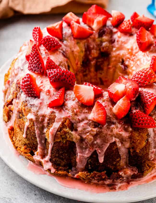 side shot of strawberry pound cake with strawberry glaze