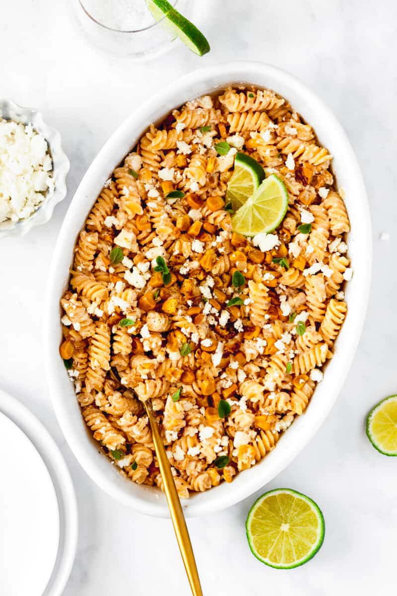 white serving platter with street corn pasta salad