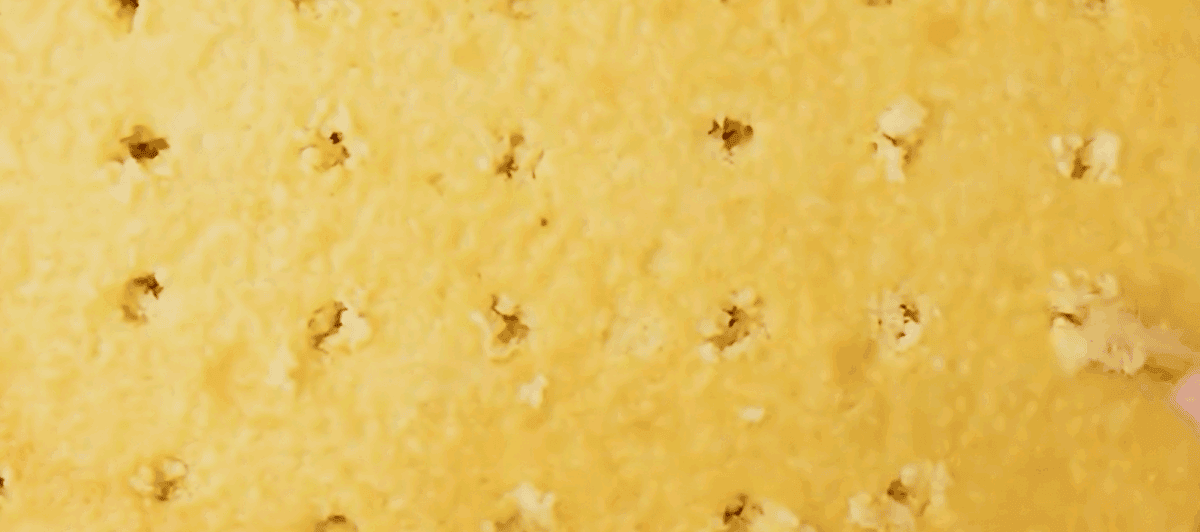 Poking holes in the baked cake. 