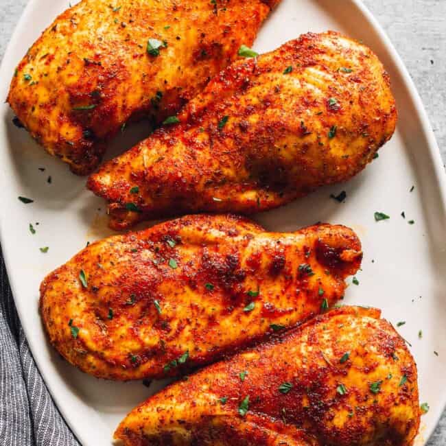 baked chicken breasts on serving platter