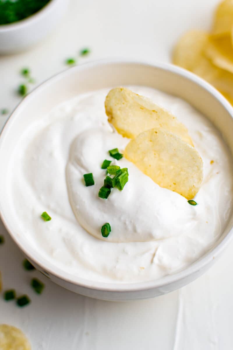 potato chip dipped in chip dip