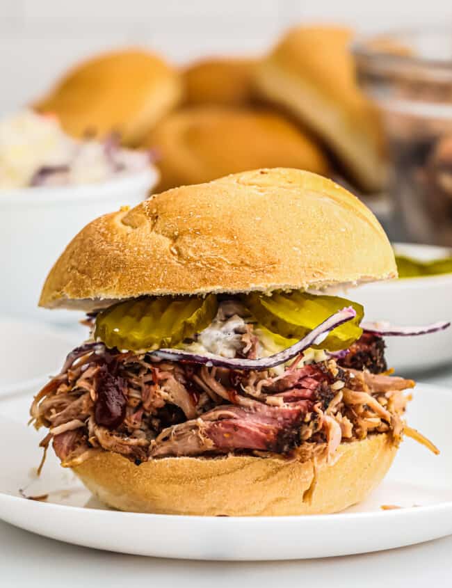 smoked pulled pork sandwich with pickles