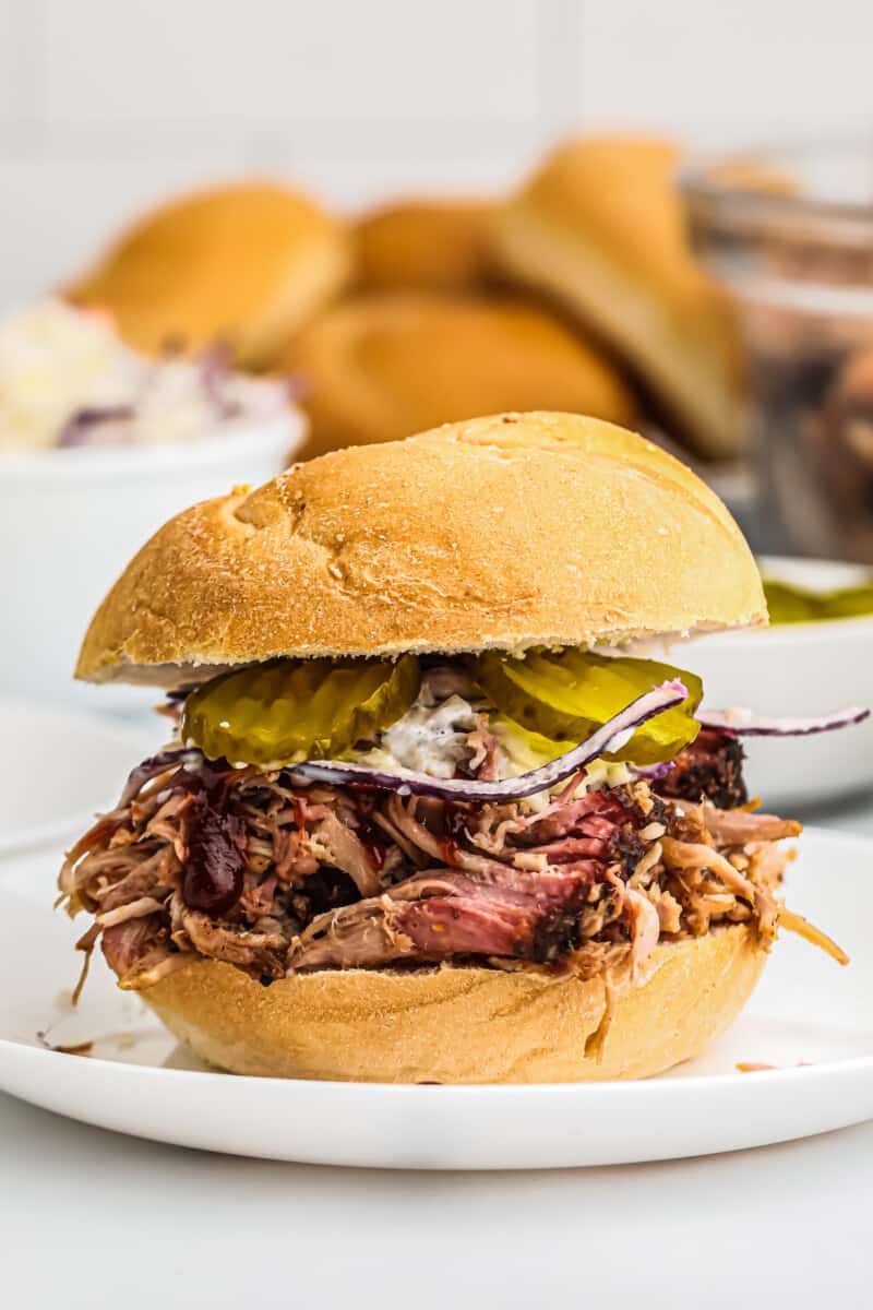 smoked pulled pork sandwich with pickles