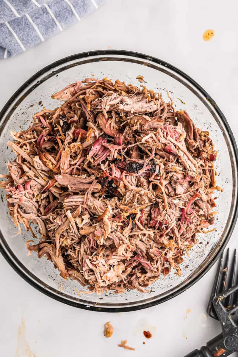 shredded smoked pulled pork in mixing bowl