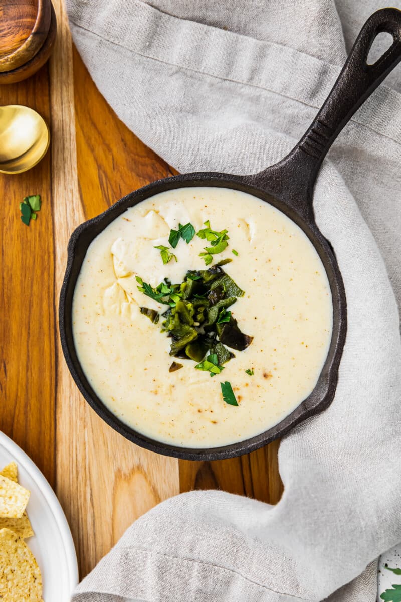 spicy poblano queso in small cast iron skillet