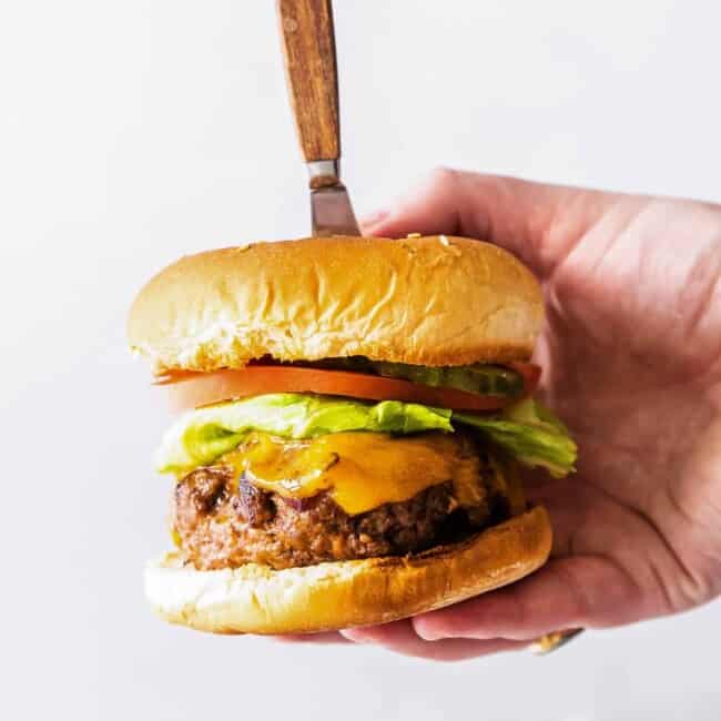 holding up air fried bbq burger