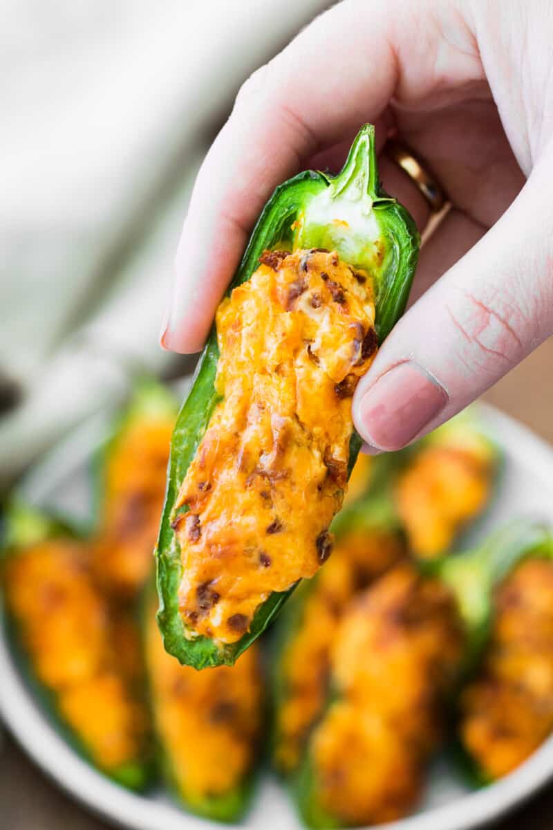 holding up air fried jalapeno popper