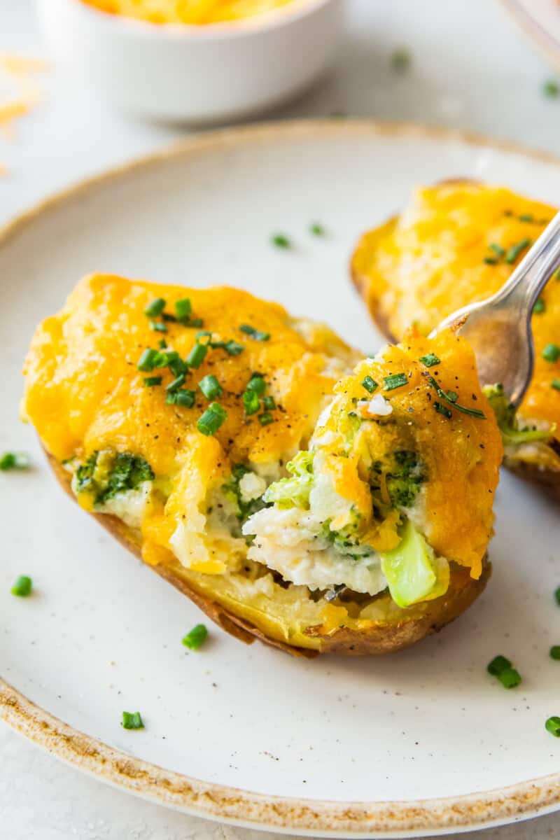 fork digging into broccoli cheese twice baked potatoes