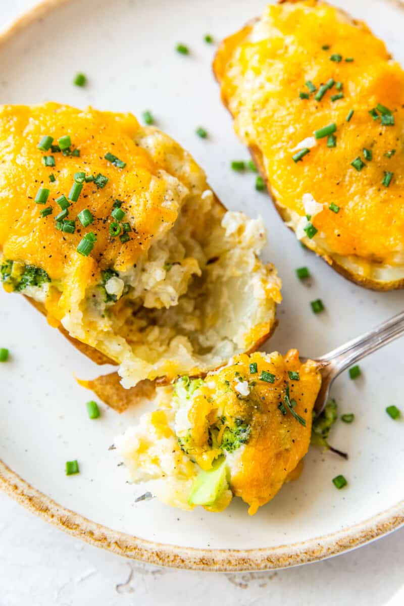 fork digging into broccoli cheese twice baked potatoes