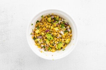 corn and avocado salsa salsa in a white bowl.