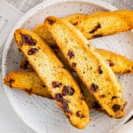cranberry orange biscotti on gray plate - 14