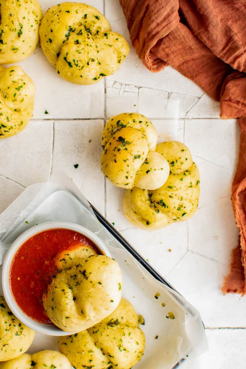 garlic knots on tile with marinara