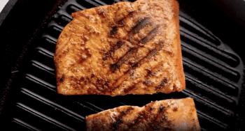Grilled salmon fillets cooked in a skillet.

Keywords: Salmon, Skillet