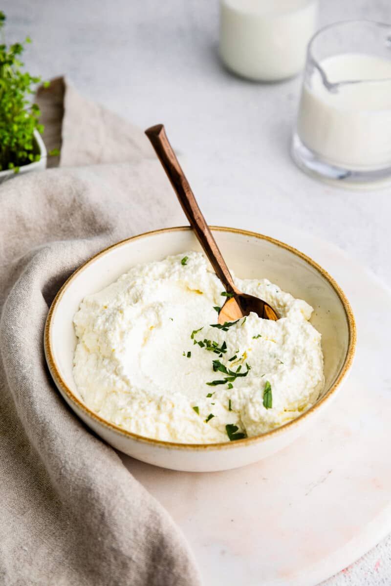 spoon in ricotta in bowl