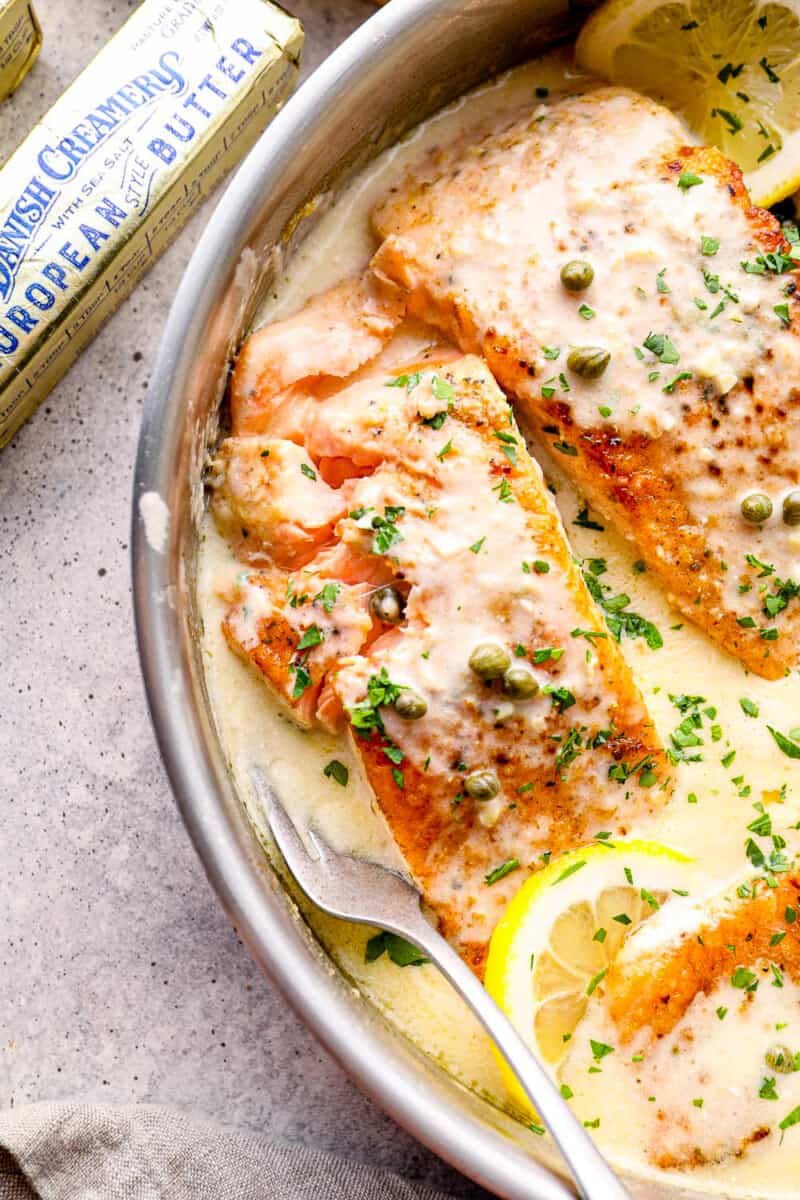 flakey creamy salmon piccata in skillet