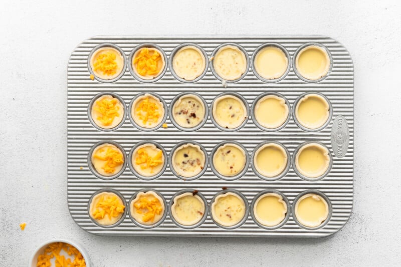 topped mini quiches in a mini muffin tin.