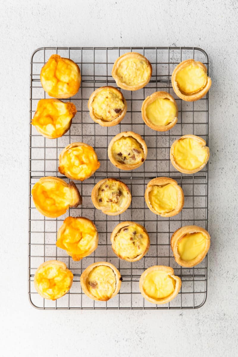 baked mini quiches on a cooling rack.