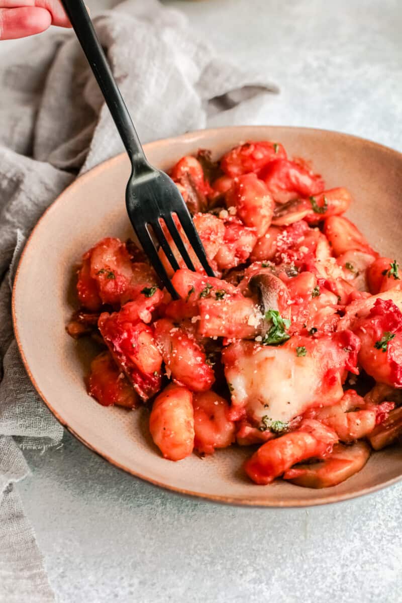plate with cheesy baked gnocchi