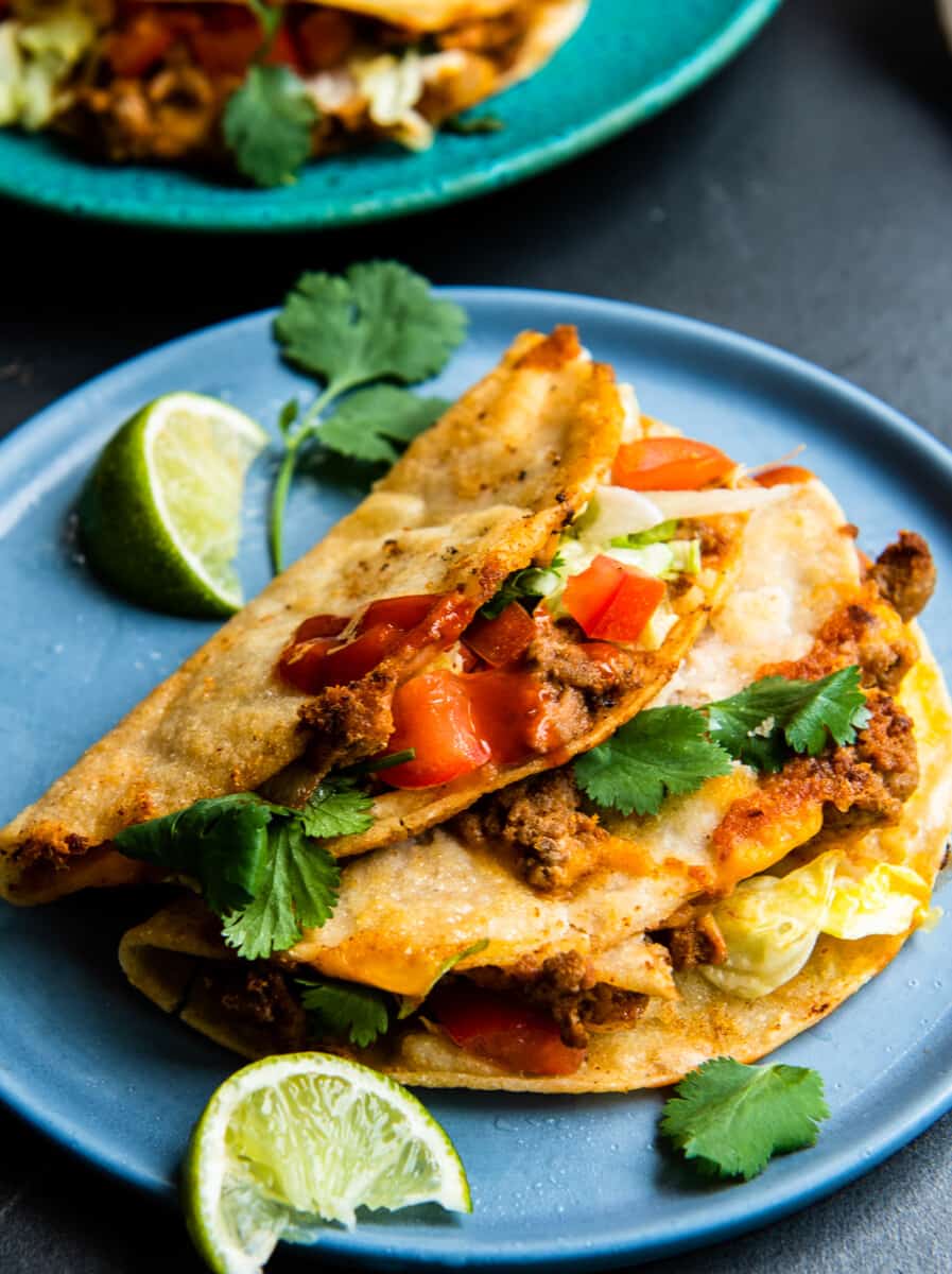 crispy turkey tacos on turquoise plate