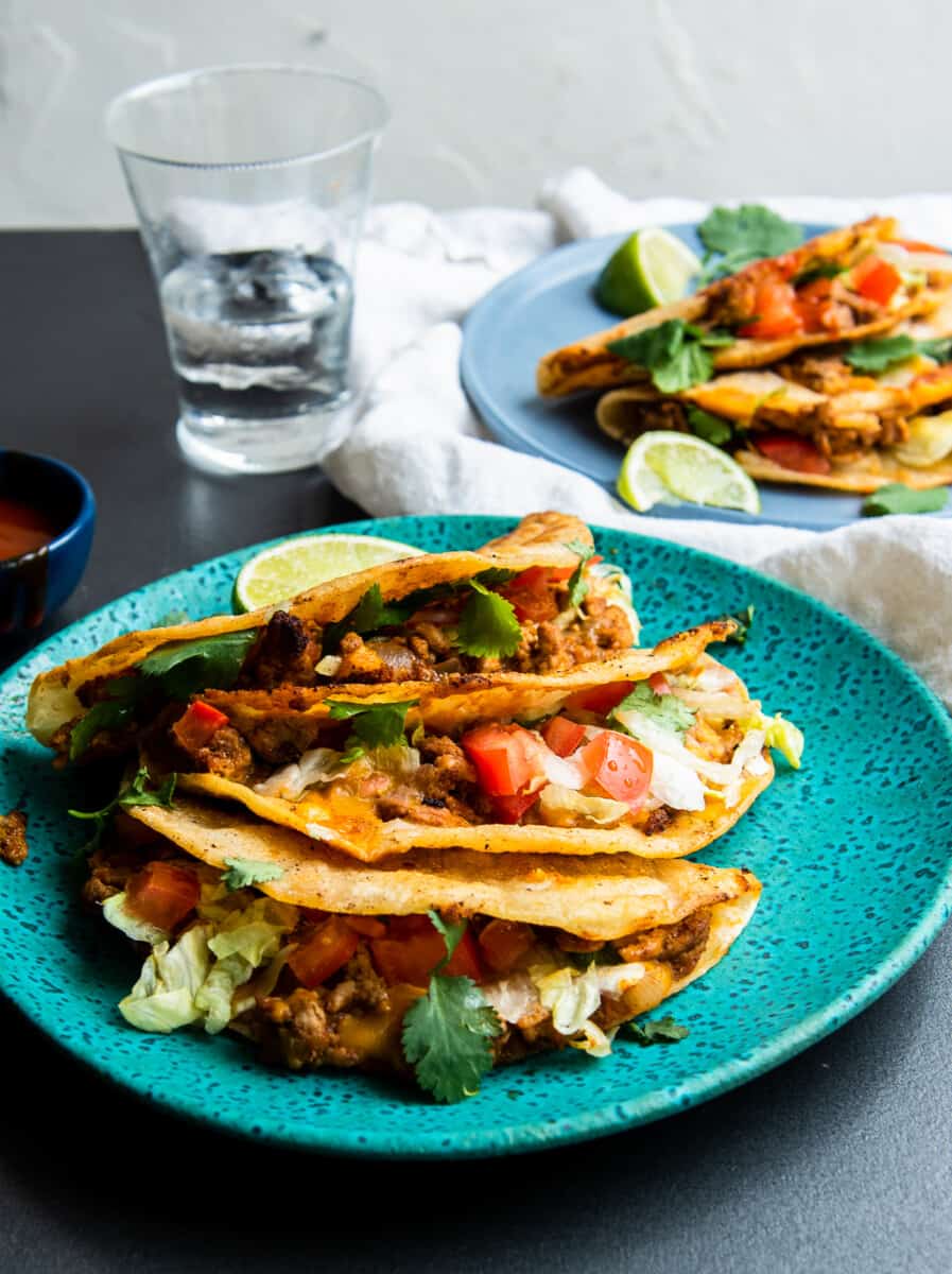 crispy turkey tacos on turquoise plate