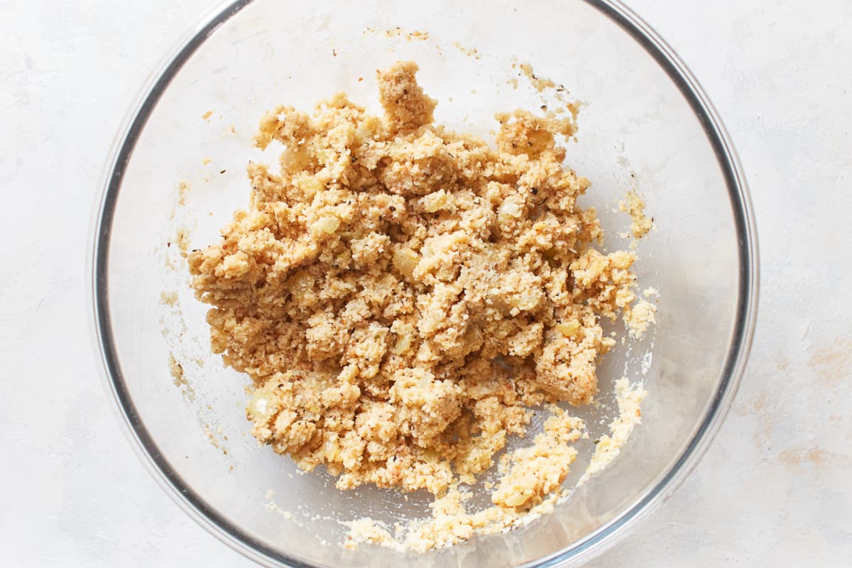 Breadcrumb mixture in a glass bowl.