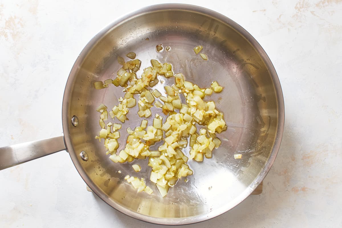 Onion and garlic in a frying pan.