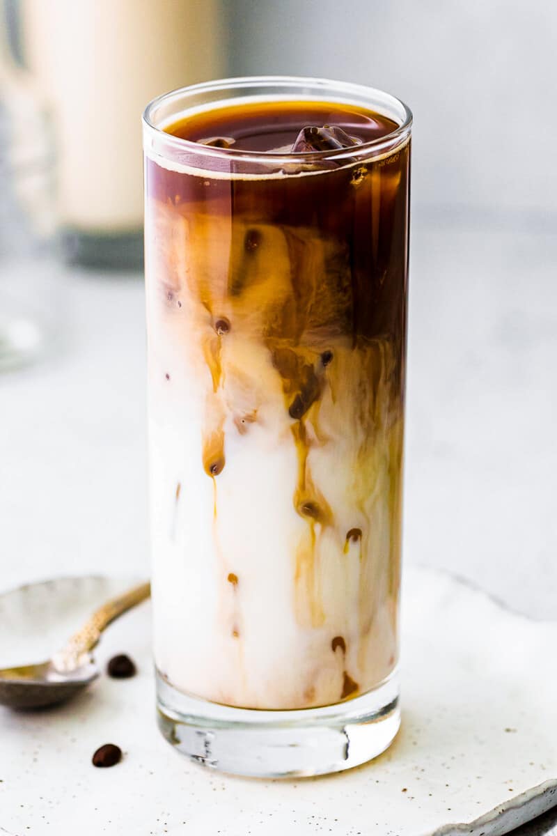 up close iced caramel macchiato in tall glass