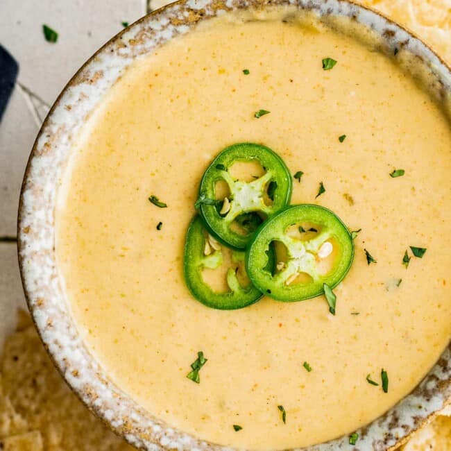 up close bowl of instant pot queso blanco with jalapenos