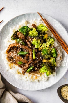 Mongolian beef and broccoli on white plate with rice