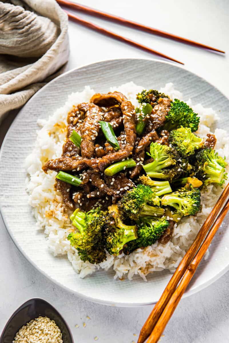 Mongolian beef and broccoli on white plate with rice