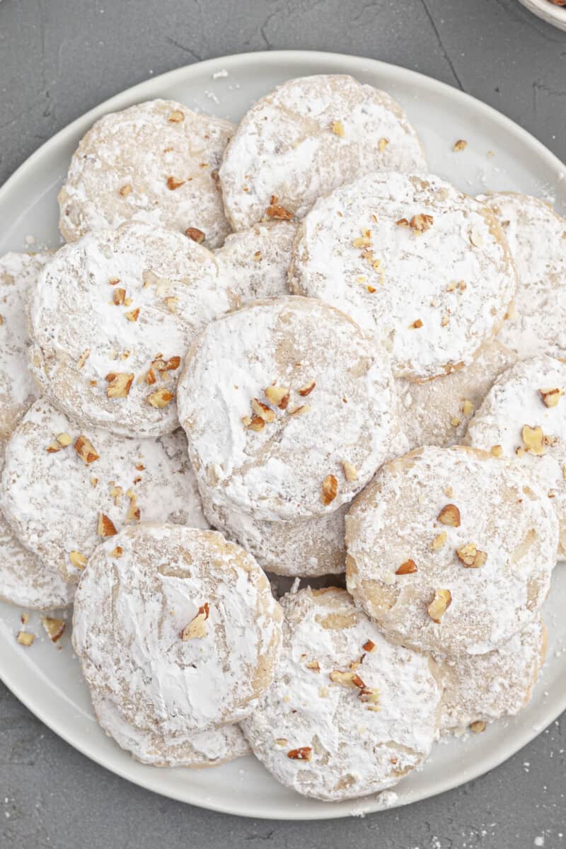 up close plate of pecan sandies cookies