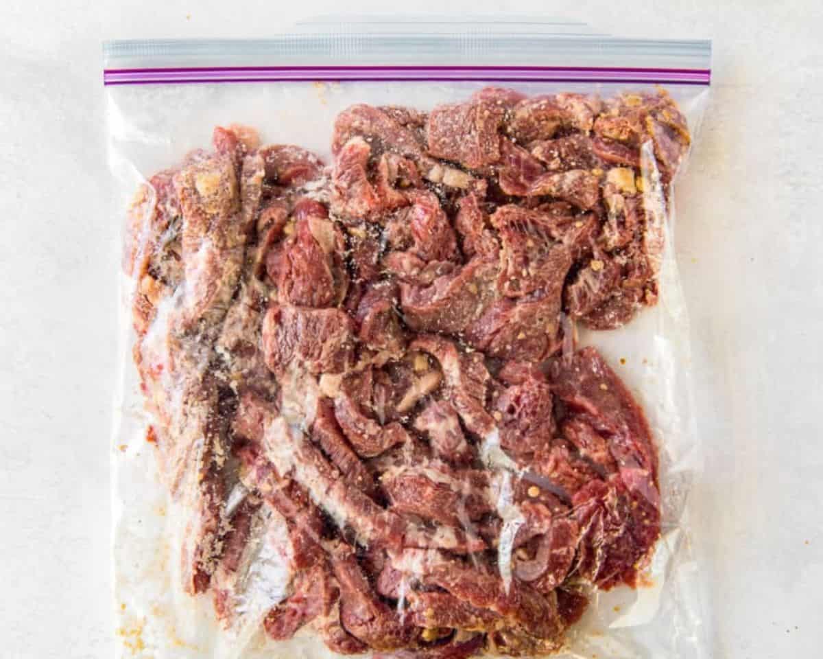 Beef in a Ziplock bag, ready to be refrigerated for marinating.