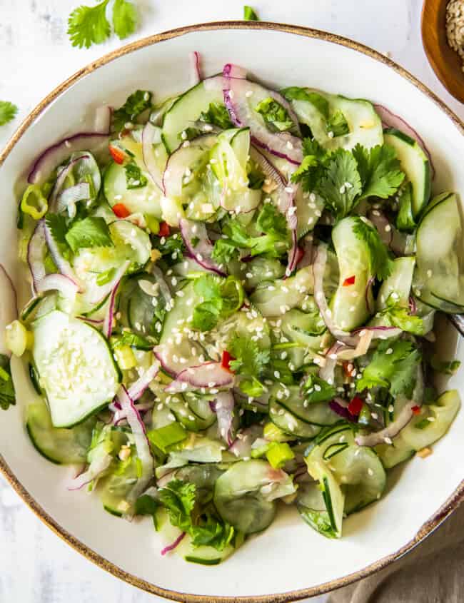 asian cucumber salad in white bowl