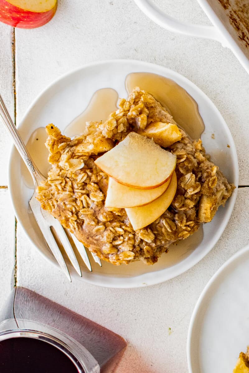 up close slice of baked apple oatmeal with apple slices