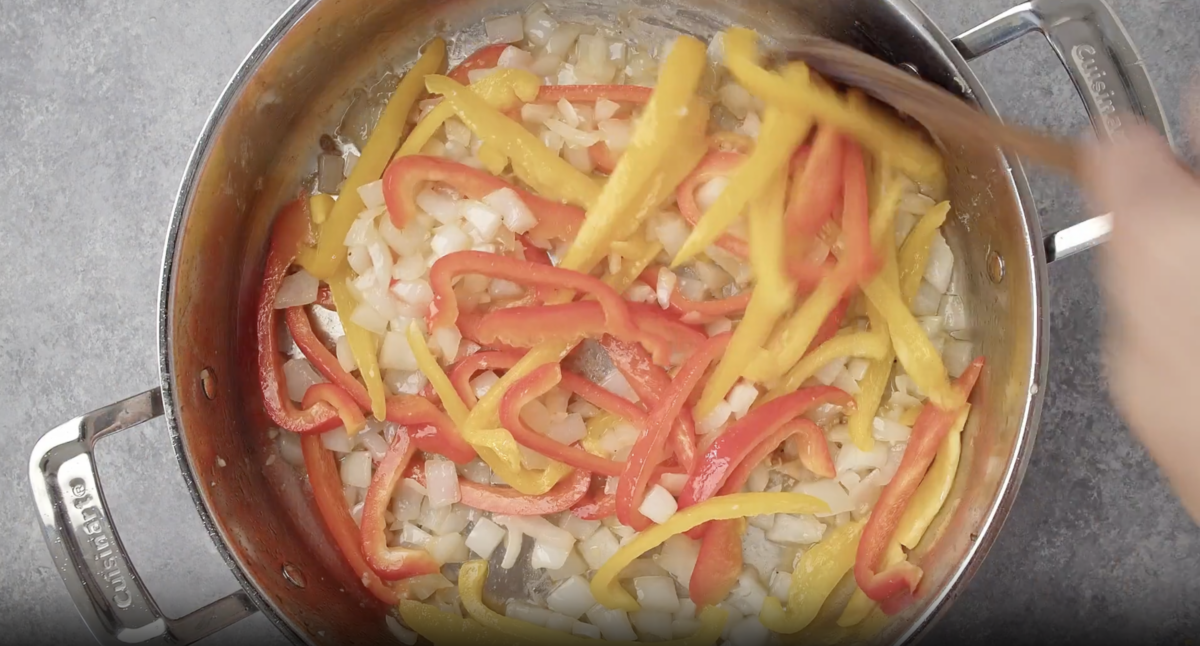 peppers and onions in a pan.
