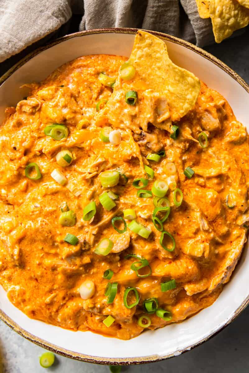 up close white bowl with crockpot buffalo chicken dip